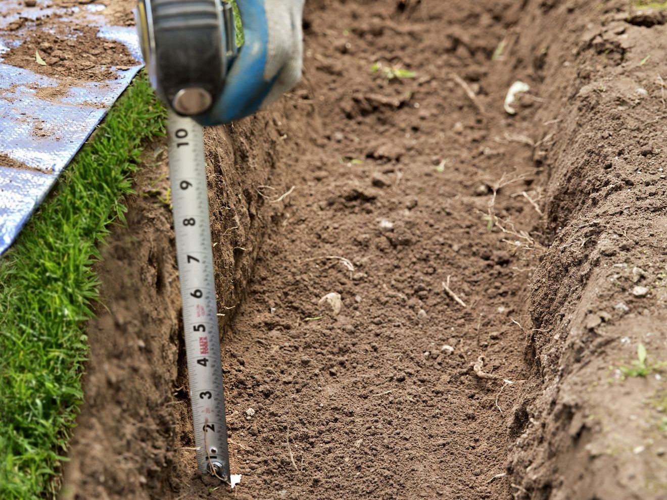 Mesuring the soil Depth Eco landscape supply edited